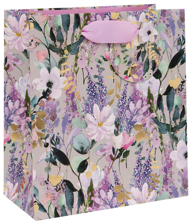 Stephanie Dyment Buddleia Medium Gift Bag with watercolour buddleia and botanical design in soft purples, lilacs, pinks and white with gold accent details and lilac ribbon handles, 200 x 225 x 100 mm, on white background