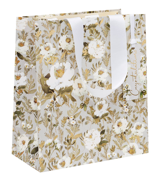 Wedding Floral medium gift bag by Stephanie Dyment, soft grey background with all-over white botanical floral design and gold foil detailing, white ribbon handles and Congratulations gift tag, 200x225x100mm