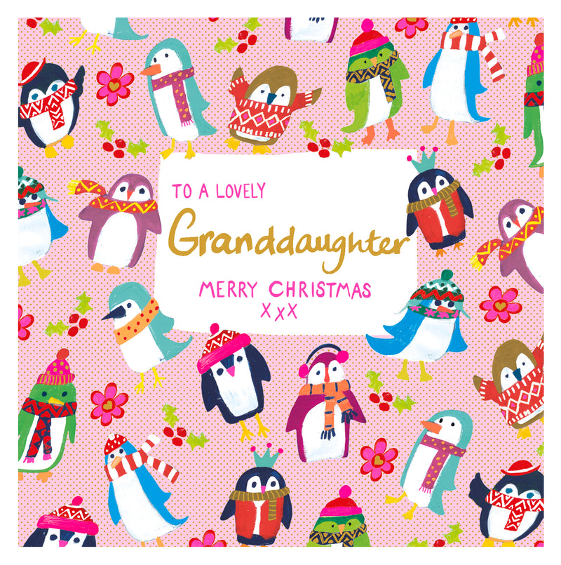 To a Lovely Granddaughter Christmas card with cheerful penguins in festive hats and scarves, alongside holly, berries and flowers