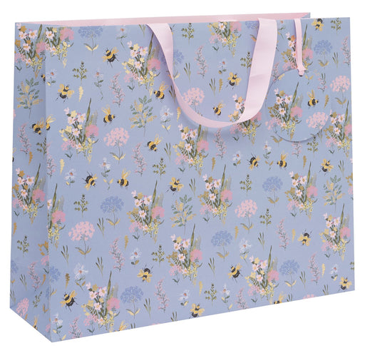Stephanie Dyment Bee Meadow Blue landscape shopper gift bag with bumblebee and wildflower design on soft blue background with pink ribbon handles on white background