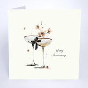 Happy Anniversary card by Five Dollar Shake, two champagne glasses with dark bow and scattered blossom on white background with glitter detail