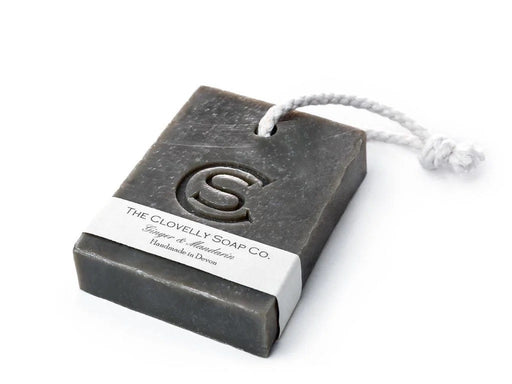 Clovelly Soap Co. Ginger & Mandarin handmade bar soap on a rope with white cotton cord, cold-process charcoal-toned bar with embossed logo, handcrafted in Devon