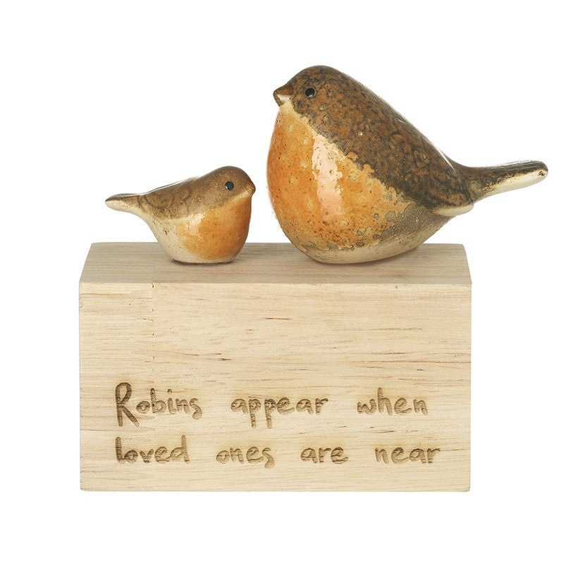 Two robin figurines, one large and one small, perched side by side on a natural wooden block engraved with "Robins appear when loved ones are near" in handwritten script, 10 x 5 x 10.9cm