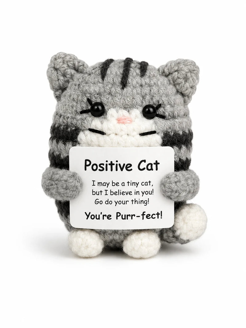 Cat Positive Crochet Gift character as a grey tabby crochet cat with striped detail and white paws holding a You're Purr-fect message, presented on a white background
