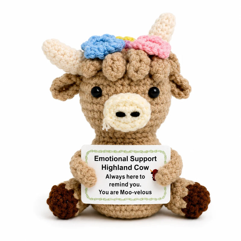 Highland Cow Positive Crochet Gift character wearing a floral crown holding a You are Moo-velous message, presented on a white background
