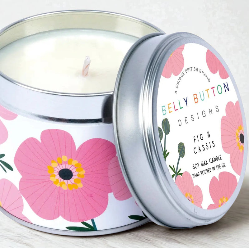 Pink Cosmos Fig & Cassis soy wax candle in bold floral silver tin, styled on a wooden surface