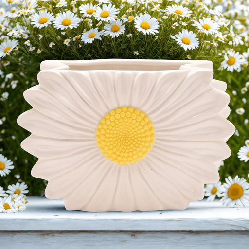 The Cottage Garden daisy ceramic vase by CELEBRATIONS, lifestyle shot — surrounded by fresh daisies