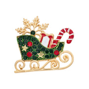 Gold plated Christmas sleigh brooch with snowflake, gift, and candy cane crystal-effect detailing
