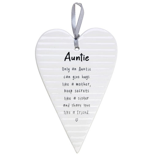 White hanging heart plaque with grey satin ribbon printed with Auntie sentiment verse reading "Only an Auntie can give hugs like a mother, keep secrets like a sister and share love like a friend"