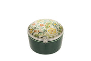 Verde Botanical Trinket Box deep forest green ceramic round hinged trinket box with botanical print lid featuring trailing foliage and open blooms on a cream background with silver-tone beaded rim and flower-detail clasp on white background