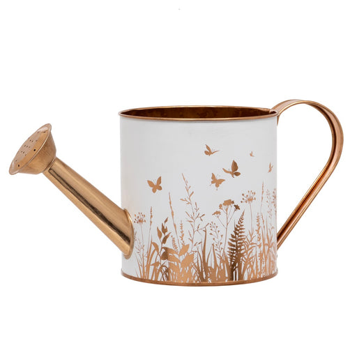 Bronze Meadow Watering Can, white metal watering can with bronze-tone meadow silhouette design of grasses, wildflower stems and butterflies in flight, curved bronze-tone handle and spout with rose head, on white background