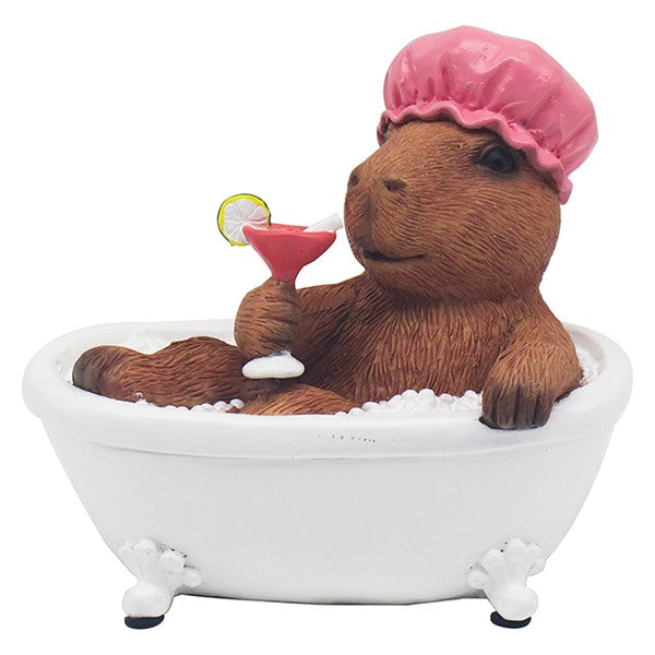 Capybara soaking in a bathtub, wearing a shower cap and holding a cocktail with a citrus garnish
