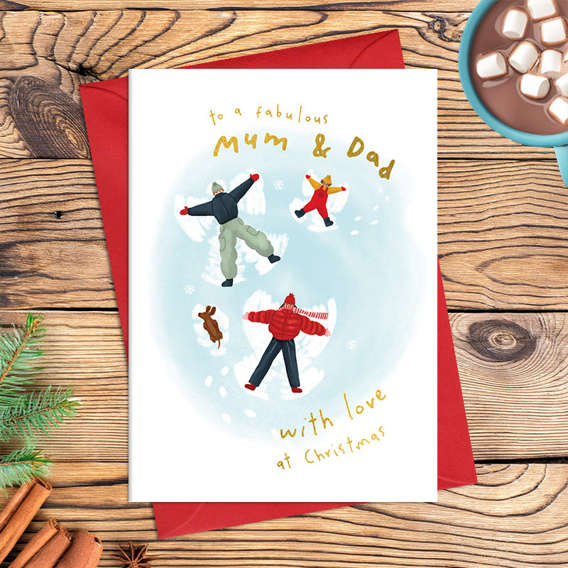 Fabulous Mum and Dad Christmas card featuring an illustrated family and dog making snow angels, with the message ‘With love at Christmas’
