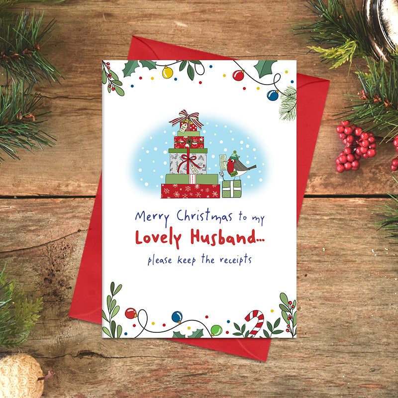 Lovely Husband Christmas card featuring illustrated wrapped presents and a robin, with the message ‘Please keep the receipts’ and a festive foliage border