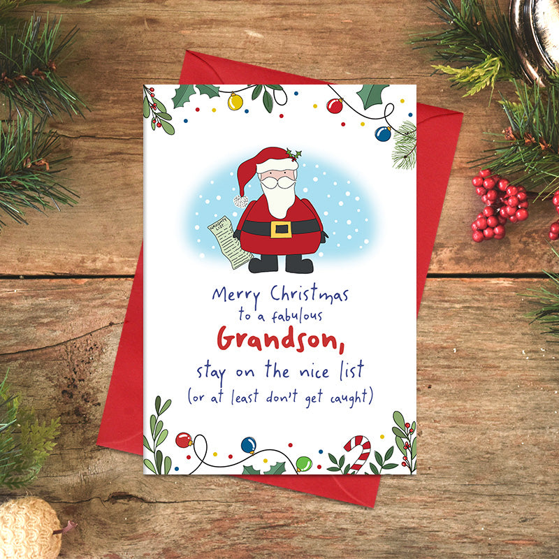 Grandson Christmas card featuring illustrated Santa holding a list, with the message ‘Stay on the nice list, or at least don't get caught’, framed by festive foliage and baubles