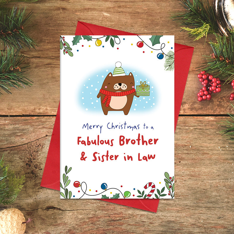 Fabulous Brother and Sister-in-Law Christmas card featuring a cheerful illustrated character in a scarf and bobble hat holding a wrapped present, framed by festive foliage and baubles.