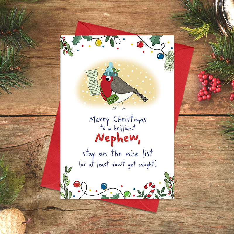 Nephew Christmas card featuring an illustrated robin in a bobble hat carrying a nice list, with the message ‘Stay on the nice list, or at least don't get caught