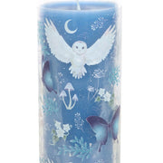 Close-up of Night Owl candle wrap featuring white barn owls, butterflies, crescent moons and woodland botanicals on a blue background