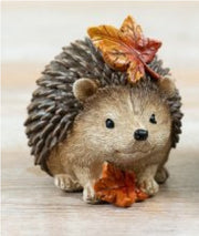 Autumn hedgehog decoration with autumn leaves, full of woodland charm