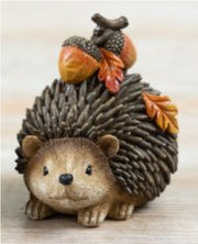 Autumn hedgehog decoration carrying acorns on his back, full of woodland charm