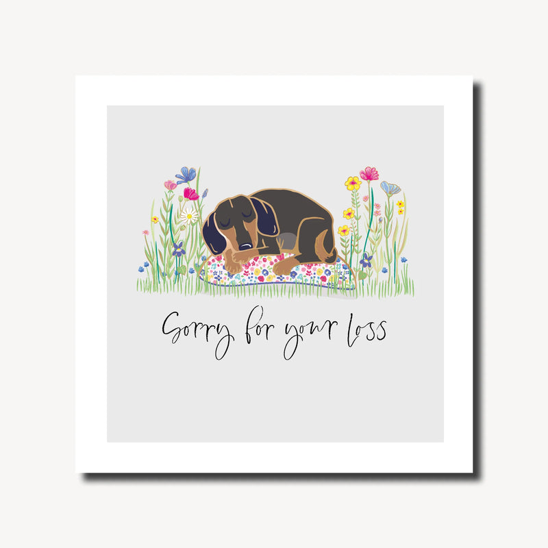 Pet sympathy card with a hand-drawn dog sleeping on a floral cushion surrounded by wildflowers, rainbow foil finish, square format 6.1 x 6.1 inches