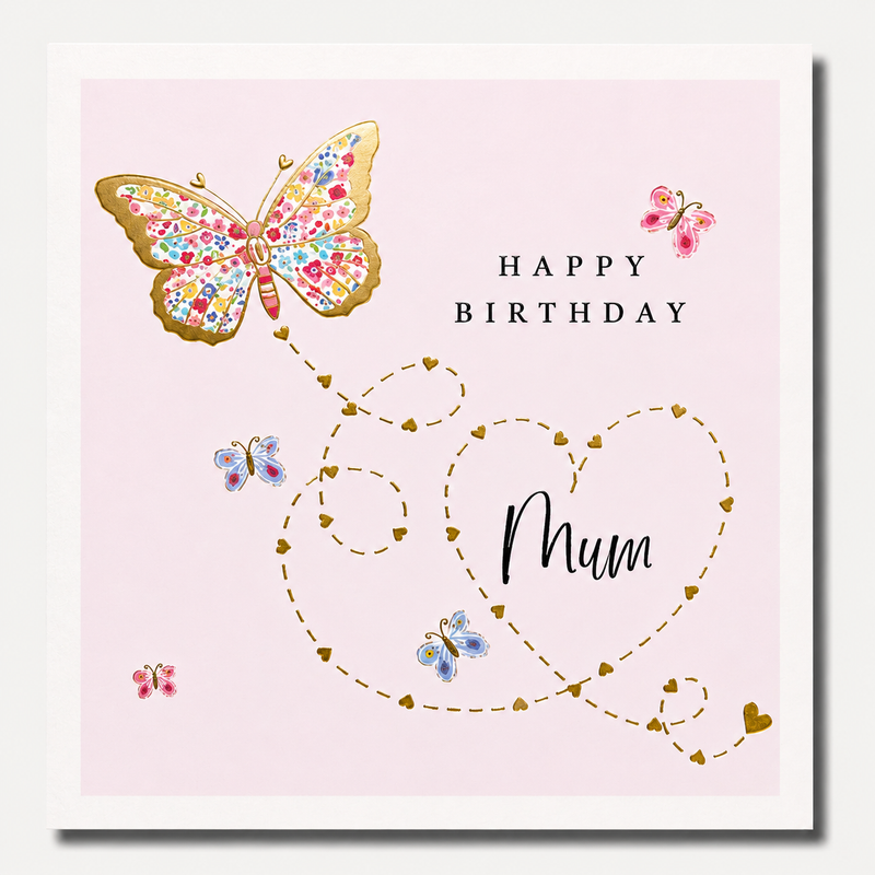 Happy birthday mum card featuring a large floral-patterned butterfly with gold outlines trailing a swirling heart path of tiny gold hearts on a soft pink background, blank inside, square format 155 x 155mm