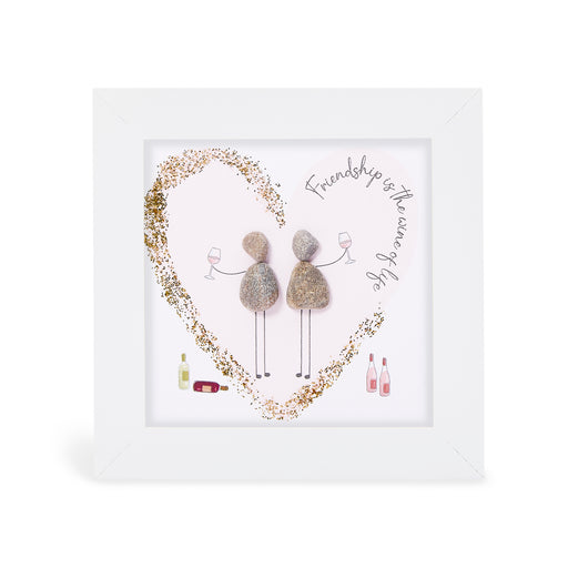 "Friendship is the wine of life" glitter mini plaque, white frame with two pebble figures raising wine glasses inside a sparkling gold glitter heart, with illustrated wine bottles