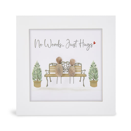 "No Words… Just Hugs" glitter mini plaque, white frame with two pebble figures sitting on an ornate bench flanked by sparkling topiary trees and a small red heart