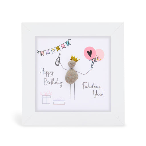 "Happy Birthday Fabulous You!" mini plaque, white frame with a pebble figure wearing a gold crown, holding a champagne bottle in one hand and two balloons in the other, with colourful bunting and gift boxes
