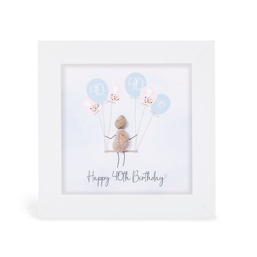 "Happy 40th Birthday" mini plaque, white frame with a pebble figure sitting on a swing holding a bunch of blue and pink balloons