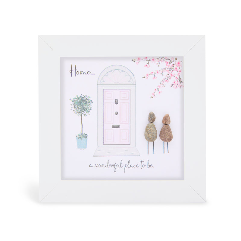 "Home…. a wonderful place to be" mini plaque, white frame with two pebble figures outside a pink front door, potted topiary tree and pink blossom branch