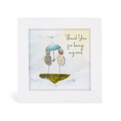 "Thank You for being my rock" mini plaque, white frame with two pebble figures sharing a blue umbrella on a floating mossy island against a cloudy sky
