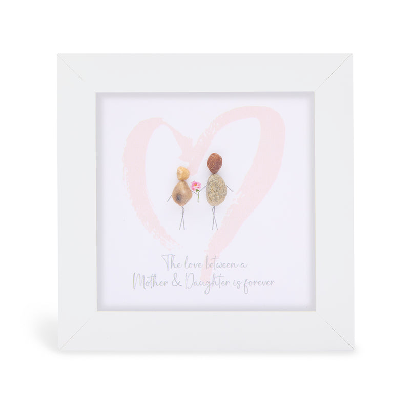 The love between a Mother & Daughter is forever mini plaque, white frame with two pebble figures holding a flower inside a soft pink heart
