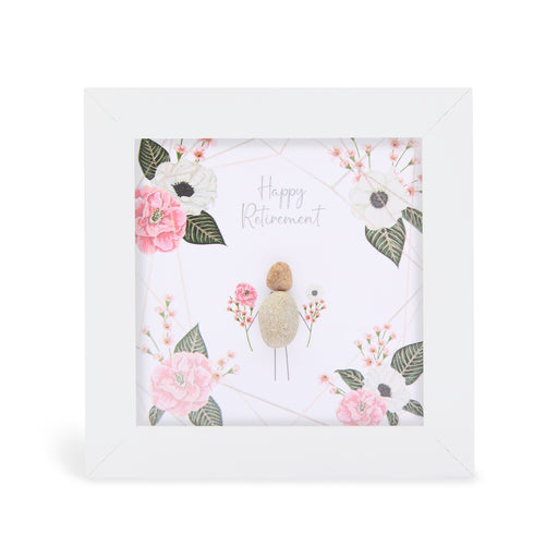 Pebble art framed plaque with a natural pebble figure surrounded by illustrated flowers and the sentiment "Happy Retirement", white frame