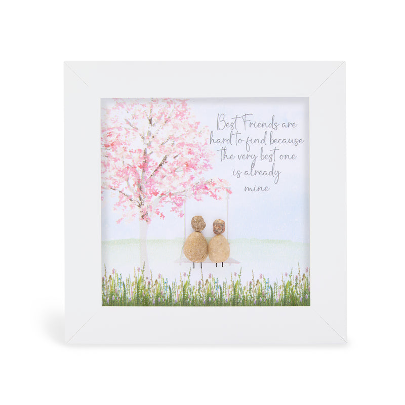 "Best Friends are hard to find because the very best one is already mine" mini plaque, white frame with two pebble figures sitting on a swing beneath a full pink blossom tree with a wildflower meadow border