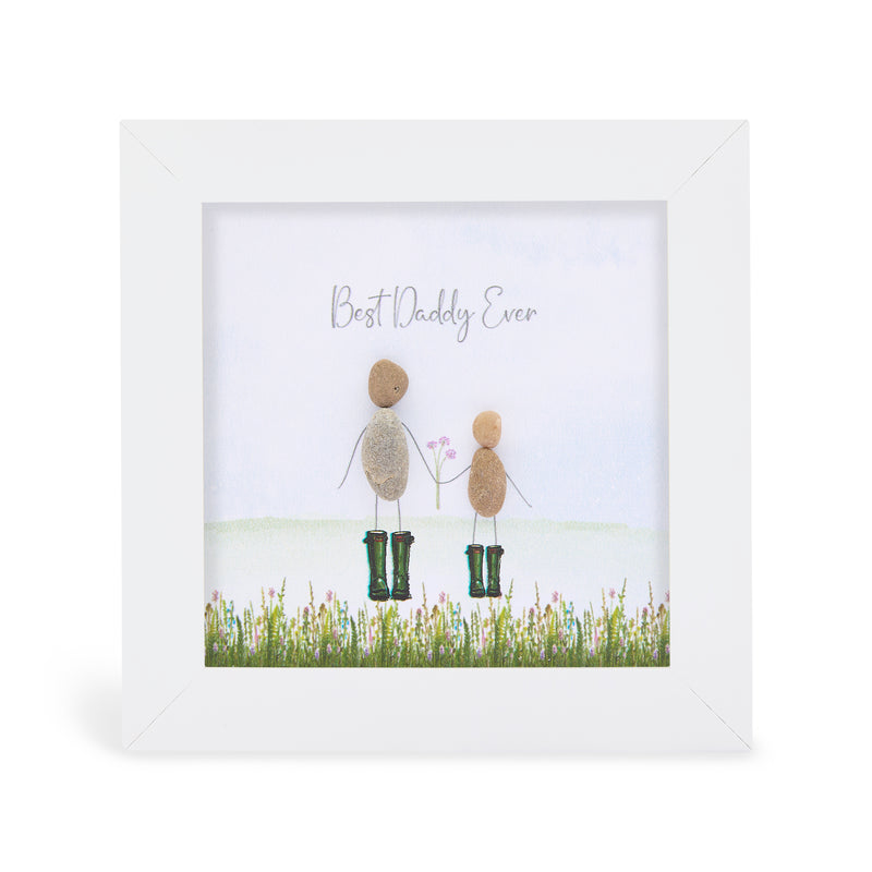 "Best Daddy Ever" mini plaque, white frame with pebble figures of a daddy and child in green wellies holding hands in a wildflower meadow