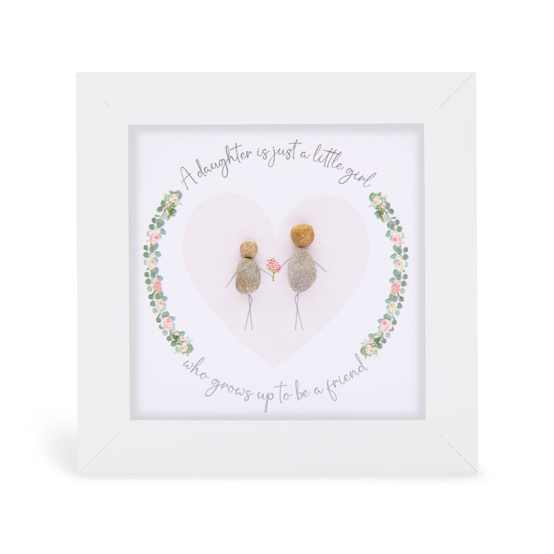 A daughter is just a little girl who grows up to be a friend" mini plaque, white frame with two pebble figures sharing a flower inside a heart shape surrounded by a floral wreath