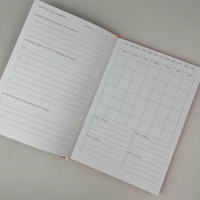 Paper Salad planner open showing monthly spread layout