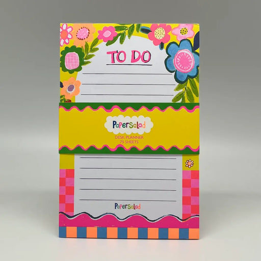 Paper Salad To Do Floral Notepad showing bold floral cover on yellow background with wavy pink border and colourful striped base with Paper Salad label