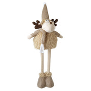 A tall fawn standing moose decoration with dark brown fabric antlers, a knitted beige pompom hat, googly eyes, a brown nose, a knitted scarf with tassels, a fluffy body and long slim legs with fluffy boots, on a white background