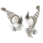 Two sitting skating snowman decorations with grey striped bobble hats, ice skates and miniature Christmas trees, one with knitted scarf