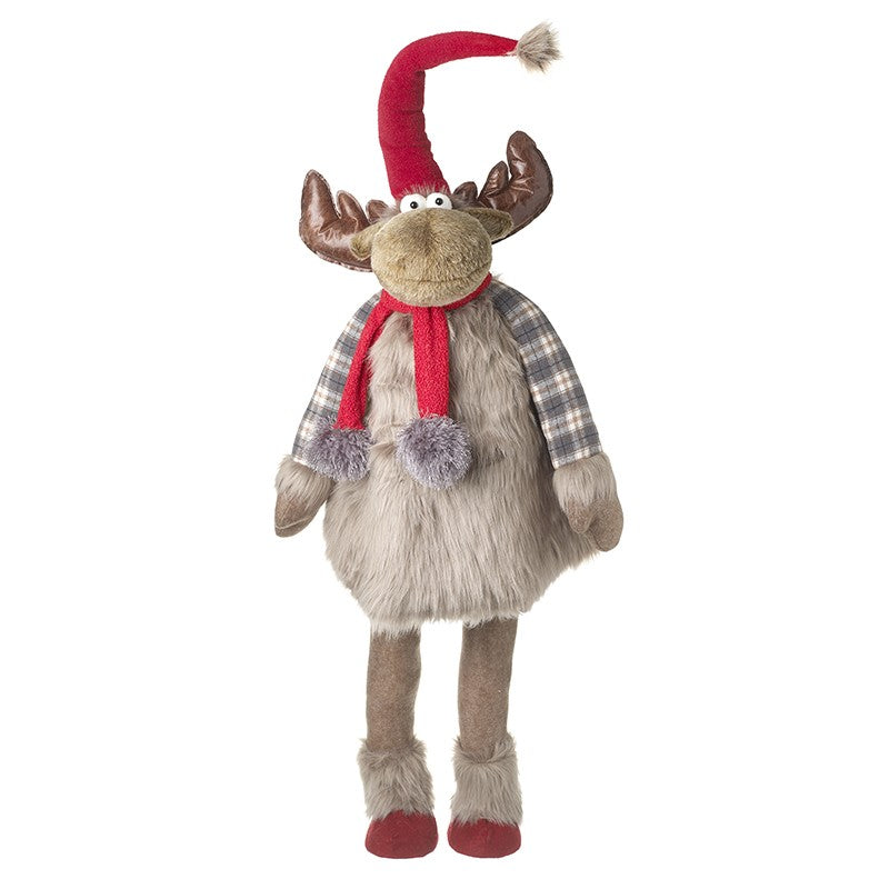 A large standing reindeer decoration with glossy brown antlers, a drooping red pompom hat, googly eyes, a red scarf with fluffy pompoms, grey check fabric arms, a fluffy grey-brown body and shaggy boots with red soles, on a white background