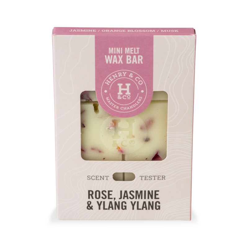 Henry & Co Mini Melt Wax Bar in Rose, Jasmine and Ylang Ylang fragrance, shown in cream and pink packaging with a dried rosebud visible through the window