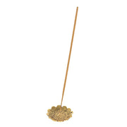 Gold-tone sunflower-shaped incense holder with a single incense stick resting in it, white background