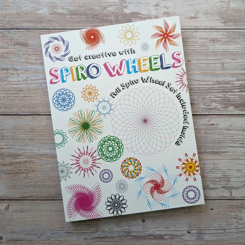 Get Creative with Spiro Wheels activity set box cover showing colourful spirograph-style pattern designs, on a wooden surface