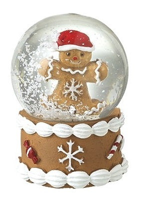 Gingerbread Christmas snow globe featuring a character in a Santa hat above a snowflake-decorated base.
