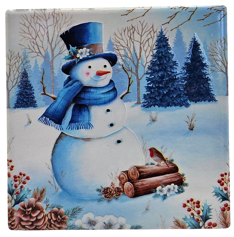 Ceramic Christmas coaster featuring a smiling snowman in a top hat and scarf, with snowy woodland trees, a robin, pinecones and berry sprigs.