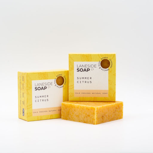 Laneside Soap Co Summer Citrus Soap Bar 135g alongside two yellow boxes on a light grey background