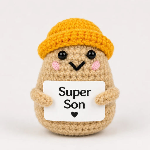 Super Son Positive Crochet Gift character wearing a mustard beanie hat and holding a Super Son sign, presented on a white background