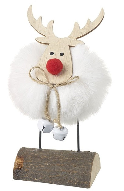 White fluffy pom-pom reindeer standing decoration with natural wood antlers, red pom-pom nose, twine bow with jingle bells and natural wood log base